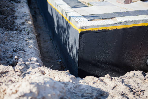 Professional Foundation Crack Repair technician working in Howard City, MI